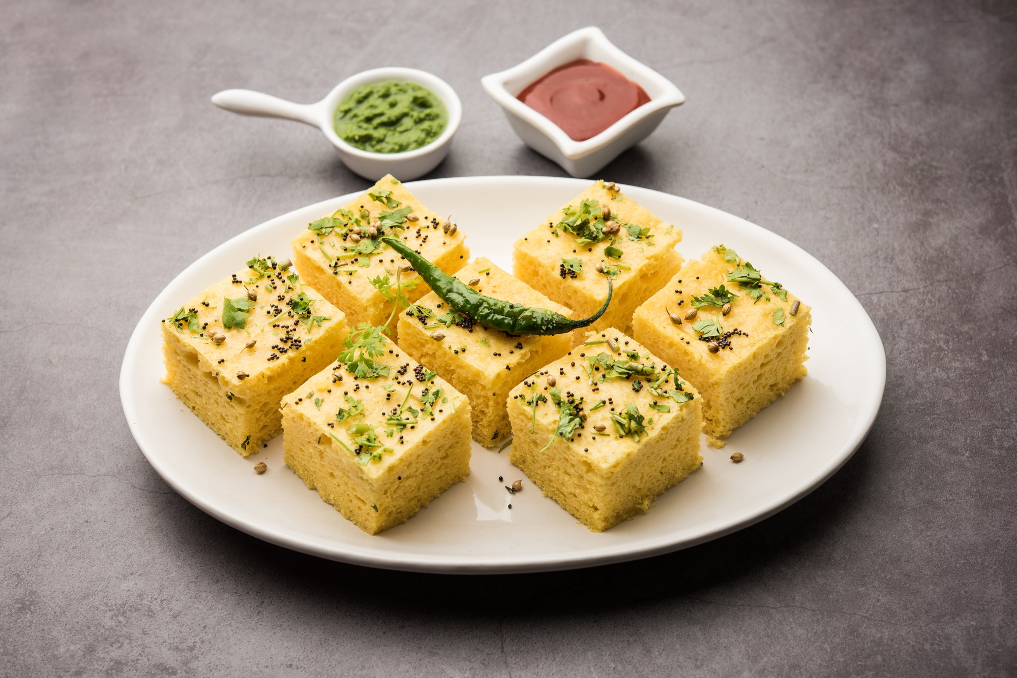 Gujarati Khaman Dhokla or Steamed Gram Flour Puffy Snack Cake